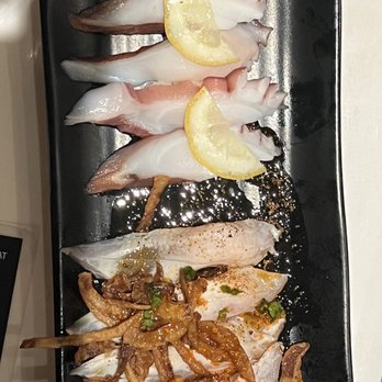 Umami - To pick is Octopus Taco and bottom is Mackerel - Japanese Near Me - Las Vegas, Nevada Umami - To pick is Octopus Taco and bottom is Mackerel - Japanese Near Me - Las Vegas, Nevada