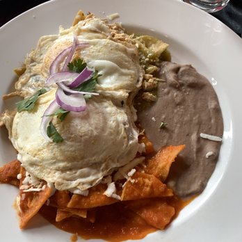 Sabor Cocinabar - Chilaquiles Divorciados with eggs and chicken. One rojo and one verde. - Mexican Near Me - San Antonio, Texas Sabor Cocinabar - Chilaquiles Divorciados with eggs and chicken. One rojo and one verde. - Mexican Near Me - San Antonio, Texas