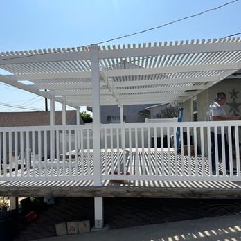 Grid Builders - a man standing on a deck - General Contractors Near Me Grid Builders - a man standing on a deck - General Contractors Near Me