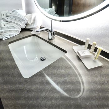 Courtyard by Marriott Ames - Bathroom sink, counter, towels, toiletries - Hotels Near Me - Ames, Iowa