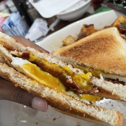 Sunnyside Cafe - Egg bacon and cheese sandwich on toast. (Over easy egg)