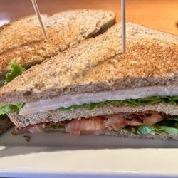 Perkins Restaurant & Bakery - Triple club sandwich, on wheat bread with fries.
