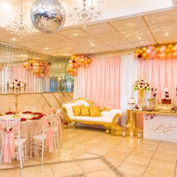 Medina Hall - Pink and gold dessert table against the mirrored wall at Medina Hall The mirrored wall doubles whatever you put in front of it.
