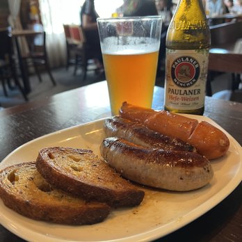 Der Biergarten - Wurst plate with two bratwurst and a knackwurst sausage. - German Near Me - Atlanta, Georgia