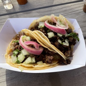 Ono Tacos - Lahaina - After garnishing the tacos. - Mexican Near Me - Kahului, Hawaii Ono Tacos - Lahaina - After garnishing the tacos. - Mexican Near Me - Kahului, Hawaii