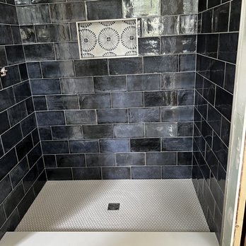 New Tile - a shower with a tiled floor - Flooring Near Me