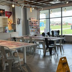 ManaHouse Coffee - Large open room Four huge tables for card playing.  Another area with smaller tables.  Many people working or running meetings.