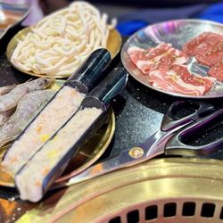 So Hot Hotpot & Korean BBQ - Shrimp, shrimp paste, udon noodles for the hot pot. Seasoned beef and pork ready to grill.