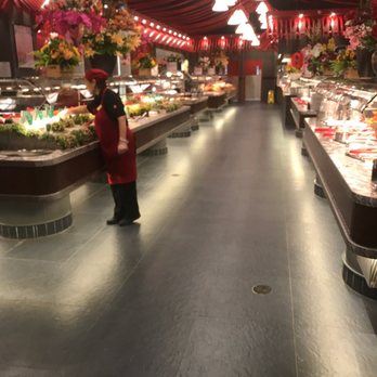 Mandarin Restaurant - a woman standing in the middle of a buffet - Buffets Near Me - Ottawa, Ontario