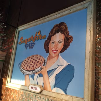 Sugarfire Pie - a woman holding a pie - Ice Cream & Frozen Yogurt Near Me - Olivette, Missouri Sugarfire Pie - a woman holding a pie - Ice Cream & Frozen Yogurt Near Me - Olivette, Missouri