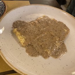 spinach ravioli with truffle sauce