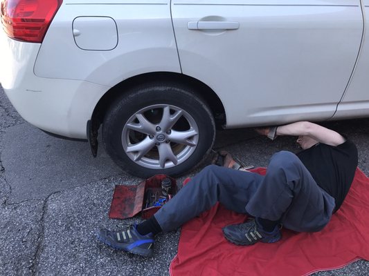 Photo of Gates Automotive - Louisville, KY, US. He's fixing my tire -- screw. Took him about 4 minutes. Seriously. $15.