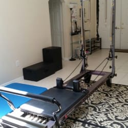 Bodies In Motion by Monique - This is the Allegro reformer with tower attachment used for Pilates based exercises.