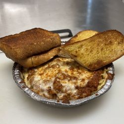Porkey’s Pizza - Baked Spaghetti with Garlic toast.