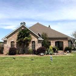 Wynne Roofing - Front of house - Installing new roof