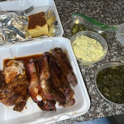 Teague’s Bar-B-Que - 3 meat BBQ plate with ribs, brisket, and chicken with sides of greens, potato salad and Corn Bread.