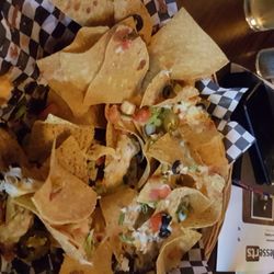 Murrayville Town Pub - Checking for cheese. Where is it??? More than half the chips had no cheese whatsoever.