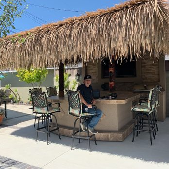 Corona BBQ Islands - Our beautiful BBQ island and TV wall.  Oh and my handsome hubby too(: - Outdoor Furniture Stores Near Me - Corona, California