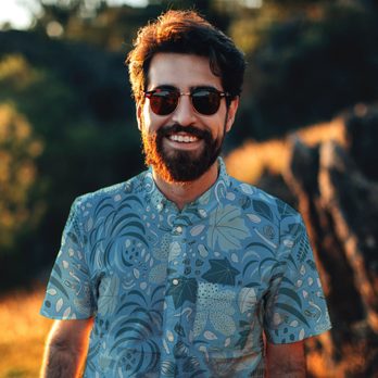 Siena Baldi - Aloha shirt featuring a custom pattern of rare seeds designed for the Seed Lab at UH - Commissioned Artists Near Me Siena Baldi - Aloha shirt featuring a custom pattern of rare seeds designed for the Seed Lab at UH - Commissioned Artists Near Me
