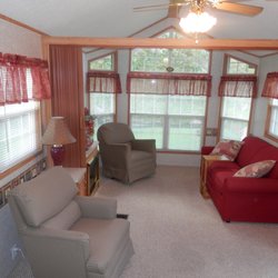 Creekside Country Resort - Livingrooms have a fireplace and a fold-out couch and big windows with breathtaking views.