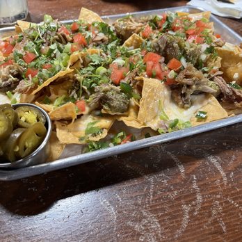 Thunderbird - Carnitas nachos (ask for salsa verde on the side) - Sports Bars Near Me - Los Angeles, California Thunderbird - Carnitas nachos (ask for salsa verde on the side) - Sports Bars Near Me - Los Angeles, California