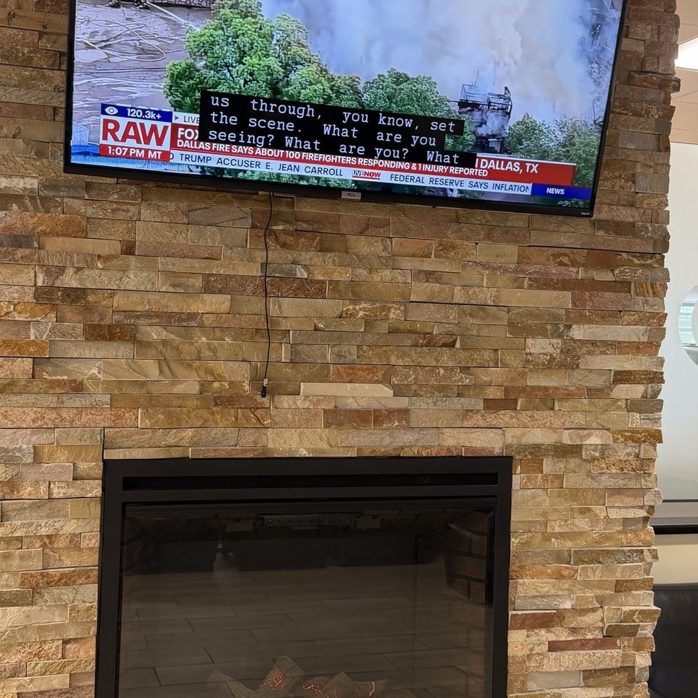 Atlantic Auto Group - Toyota waiting room has an electric fireplace - Car Dealers Near Me - West Islip, New York