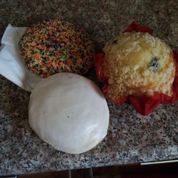 a muffin and a donut on a counter a muffin and a donut on a counter