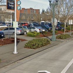 FlixBus - Flixbus bus stop station (silver pole with small light green sign) in Everett, WA