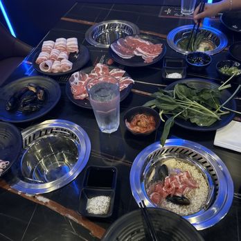 Blazing King - Pork belly, lamb, beef, mussels, and spinach ready to jump into my broth jacuzzi - Barbeque Near Me - Palm Desert, California Blazing King - Pork belly, lamb, beef, mussels, and spinach ready to jump into my broth jacuzzi - Barbeque Near Me - Palm Desert, California