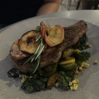 Buttercup - Pork chop with apple, zucchini, corn, and squash. - Bars Near Me - Natick, Massachusetts
