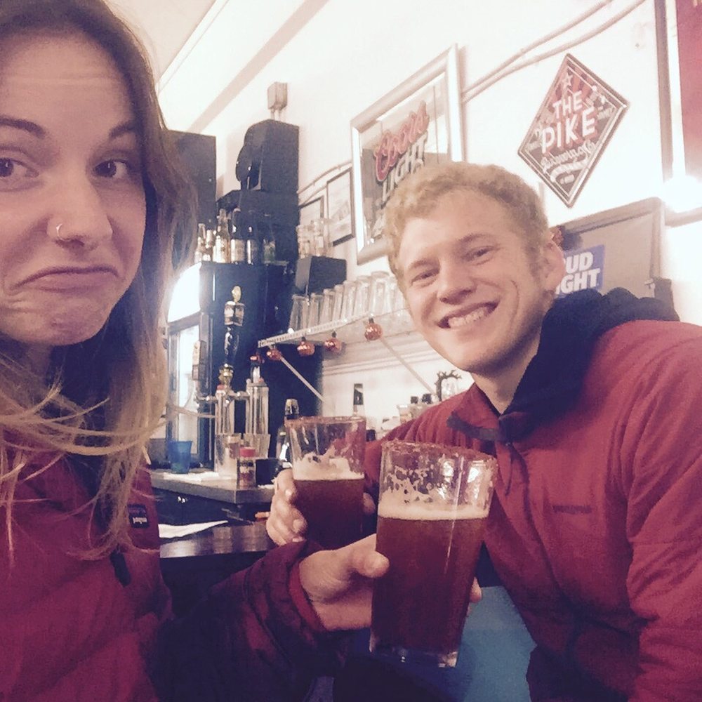 two people sitting at a bar two people sitting at a bar