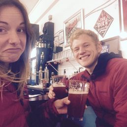 two people sitting at a bar two people sitting at a bar