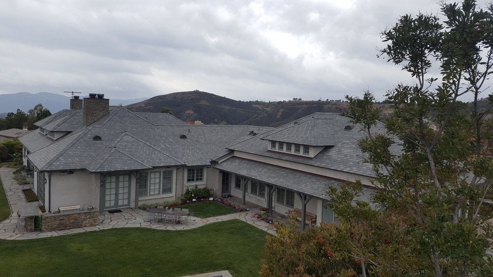 Slide of CJ West Roofing