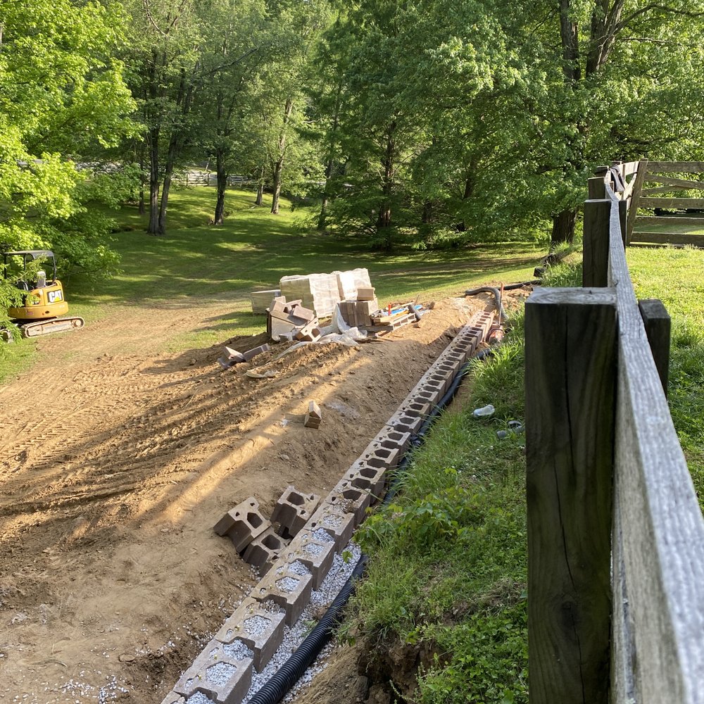 Welsh Landscaping & Nursery - Laying the base of the new wall - Landscaping Near Me - Monkton, Maryland