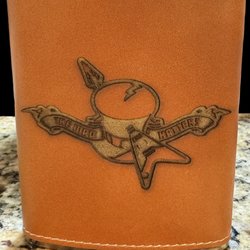 Our Merch Guy - The Mad Hatters flask.