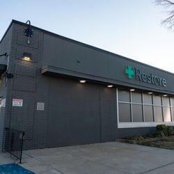 Restore Dispensaries - Exterior of back of building from Church Ln