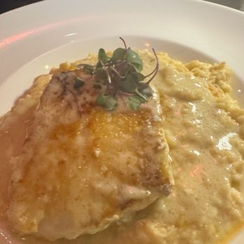 Vines by the H - Award Winning Pan Seared Chilean Sea Bass with lobster risotto. - Steakhouses Near Me - Sand Lake, Florida Vines by the H - Award Winning Pan Seared Chilean Sea Bass with lobster risotto. - Steakhouses Near Me - Sand Lake, Florida