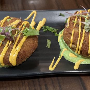 Himali Bistro - Crab cakes Succulent lump crab served over mint chutney Nepali achar aioli drizzle and cilantro micro green garnish - Indian Near Me - Burlingame, California Himali Bistro - Crab cakes Succulent lump crab served over mint chutney Nepali achar aioli drizzle and cilantro micro green garnish - Indian Near Me - Burlingame, California