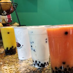 Fresh papaya pearl,  fresh durian, hot pearl milk tea, and fresh mango