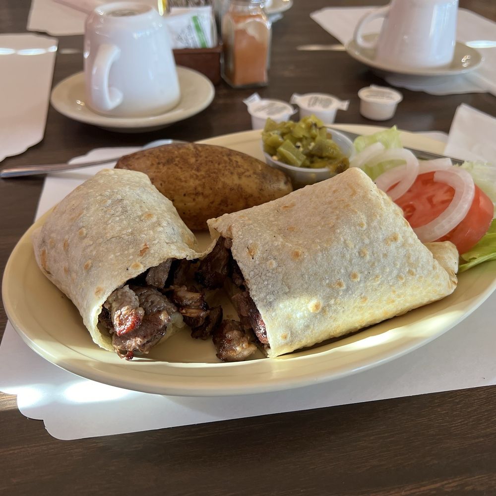 Navajo Diced Mutton ( Lamb) rolled in a tortilla with baked potato and veggies. Navajo Diced Mutton ( Lamb) rolled in a tortilla with baked potato and veggies.