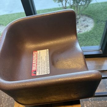 Hog & Tradition - Booster seat on picnic table bench presents a safety hazard. - Barbeque Near Me - Henderson, Nevada