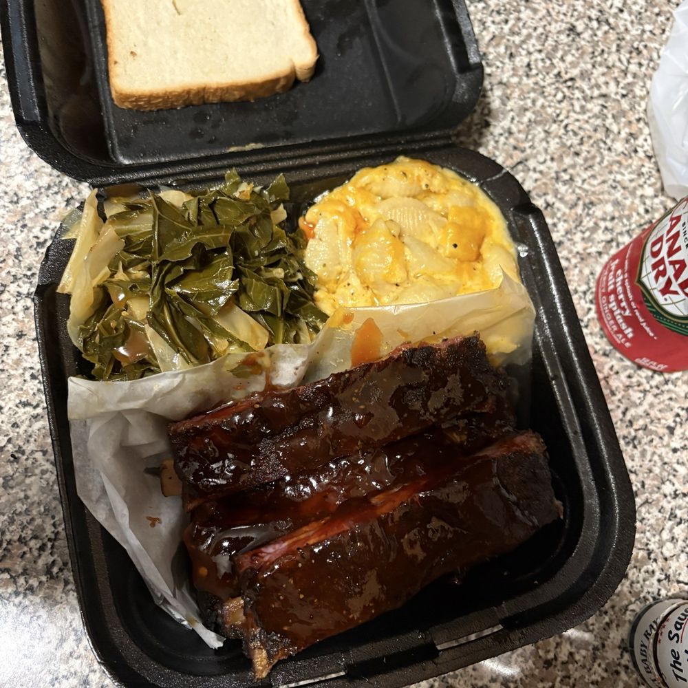 Ribs Dinner Plate, the sides are collard greens and Mac and cheese. Ribs Dinner Plate, the sides are collard greens and Mac and cheese.