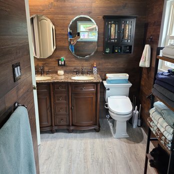 Total Bath Transformations - a wood paneled bathroom - General Contractors Near Me