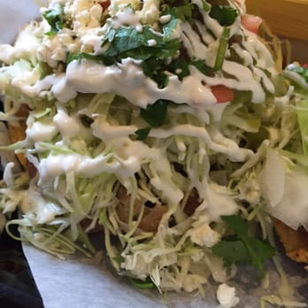 Spanglish - Chicken tostada. You really only need one :-) and some chips and salsa....and an horchata. - Mexican Near Me - Traverse City, Michigan Spanglish - Chicken tostada. You really only need one :-) and some chips and salsa....and an horchata. - Mexican Near Me - Traverse City, Michigan