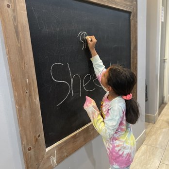 Rollin Creamery - Young artist testing out the chalkboard wall - Ice Cream & Frozen Yogurt Near Me - Bakersfield, California Rollin Creamery - Young artist testing out the chalkboard wall - Ice Cream & Frozen Yogurt Near Me - Bakersfield, California
