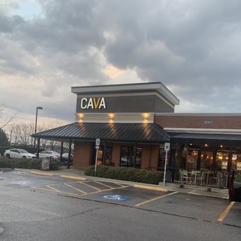 CAVA - a car parked in front of a restaurant - Mediterranean Near Me - Cary, North Carolina