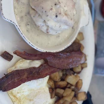 Bread and Butters Eatery - Biscuit and gravy with eggs, potatoes and bacon - Breakfast & Brunch Near Me - Parker, Colorado Bread and Butters Eatery - Biscuit and gravy with eggs, potatoes and bacon - Breakfast & Brunch Near Me - Parker, Colorado