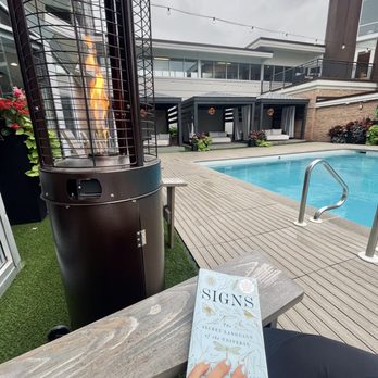 Delamar - Poolside reading - Hotels Near Me - Traverse City, Michigan