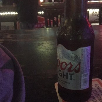 Toads Tavern - a bottle of beer on a coaster - Bars Near Me - Des Moines, Iowa