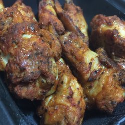 Little Cesars - No sauce wings are sometimes better. Just oven baked.